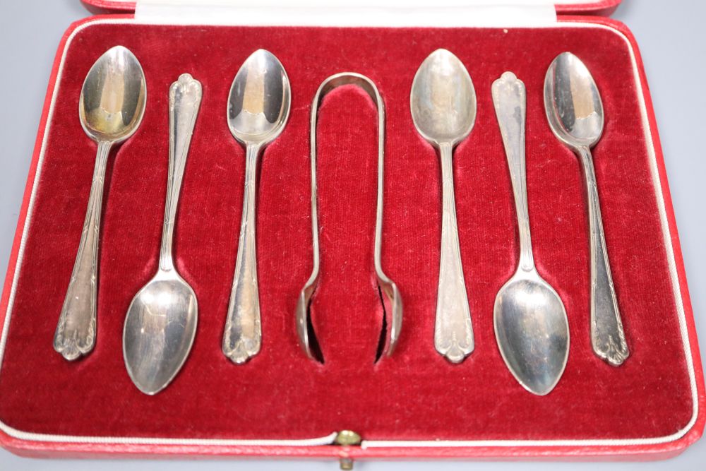 Mixed silver including cased set of six teaspoons, card case, aide memoir, vesta, Irish trophy cup and modern wine coaster.